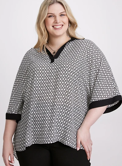Blouse contrastante à motif géométrique