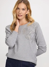 Pull à fleurs en pierres