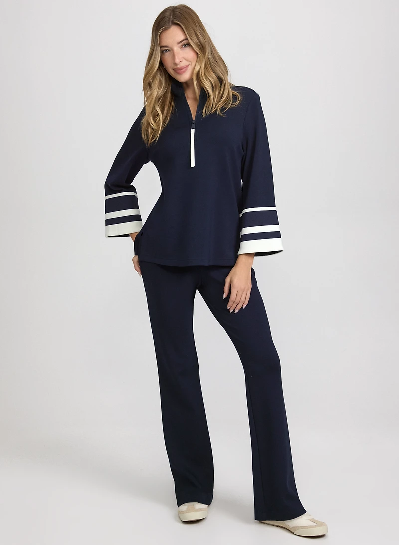 Haut à demi-fermeture éclair et pantalon évasé à enfiler