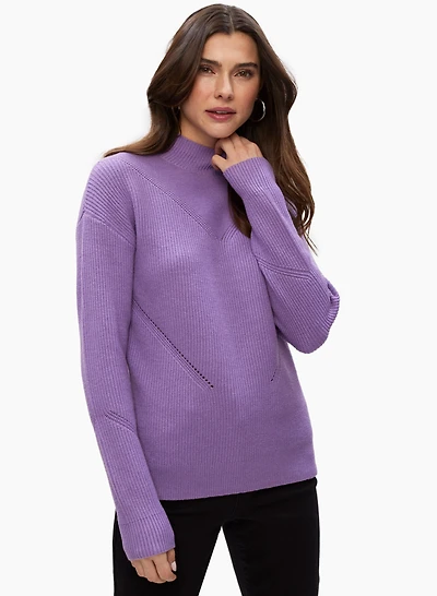 Pull à col montant et détails ajourés