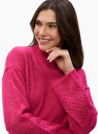 Pull à col montant et détails ajourés