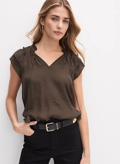 Blouse avec cordon à pompons