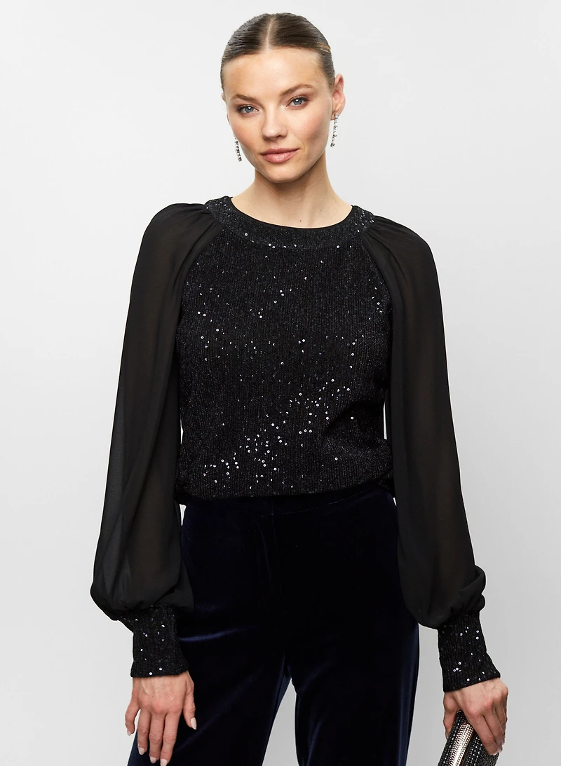 Haut à paillettes et manches bouffantes