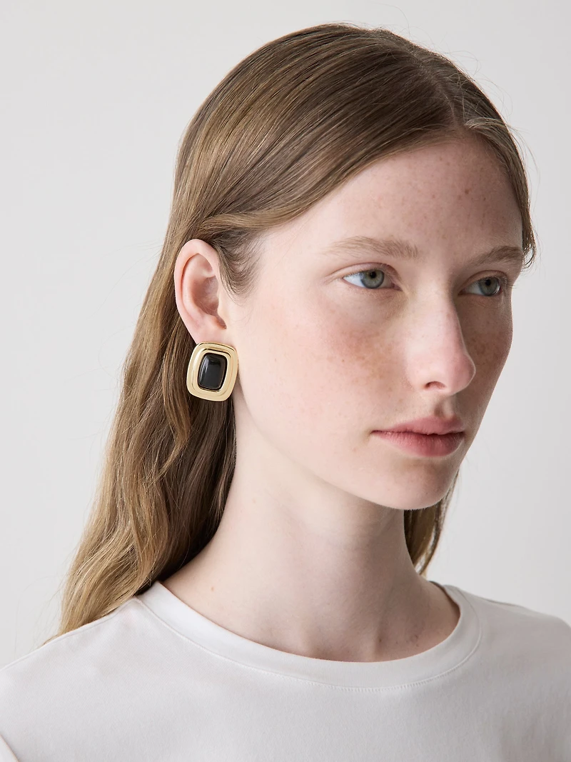 Boucle d'oreille statement en métal avec bordure dorée