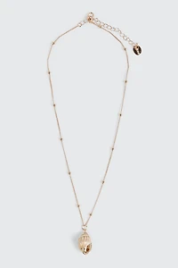 Collier avec pendentif coquillage