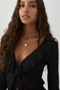 Blouse à manches longues volants