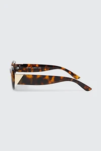 Lunettes de soleil à monture ovale épaisse