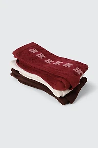 Mi-chaussettes en tricot torsadé à motif de boucles