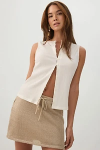 Veste sans manches boutonnée en tissu gaufré
