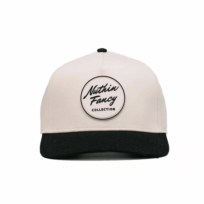 Comus Two Toned Trucker Hat in White and Black