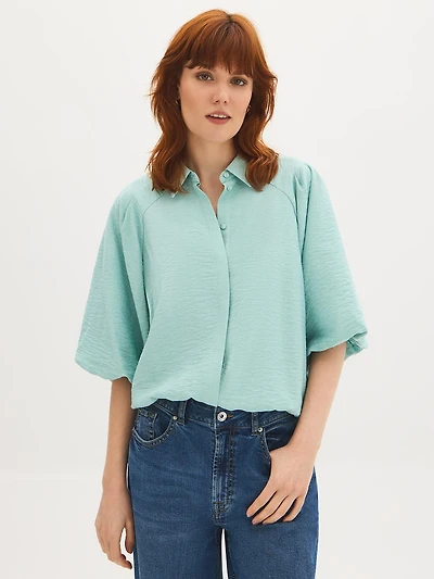 Blouse à manches bouffantes boutonnée sur le devant