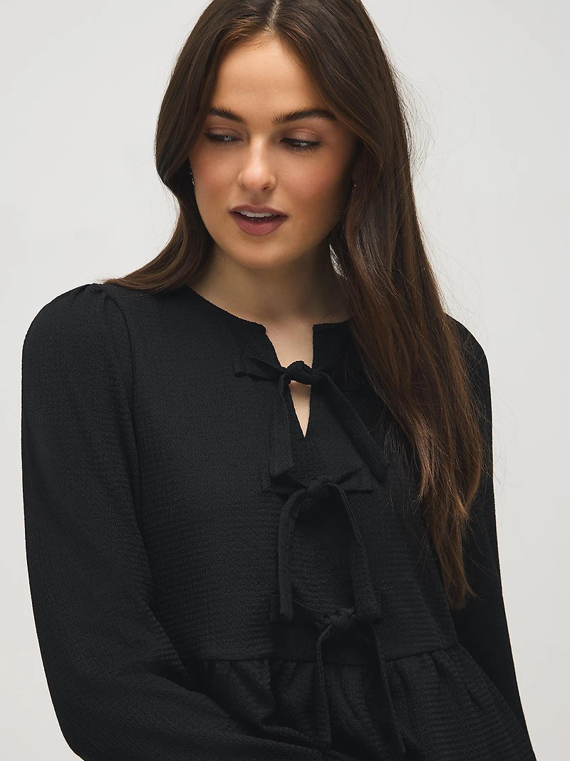 Haut péplum avec boucles