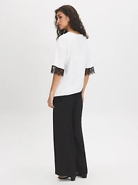 Haut asymétrique avec bordure en dentelle