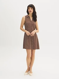 Mini-robe chemise sans manches à pois