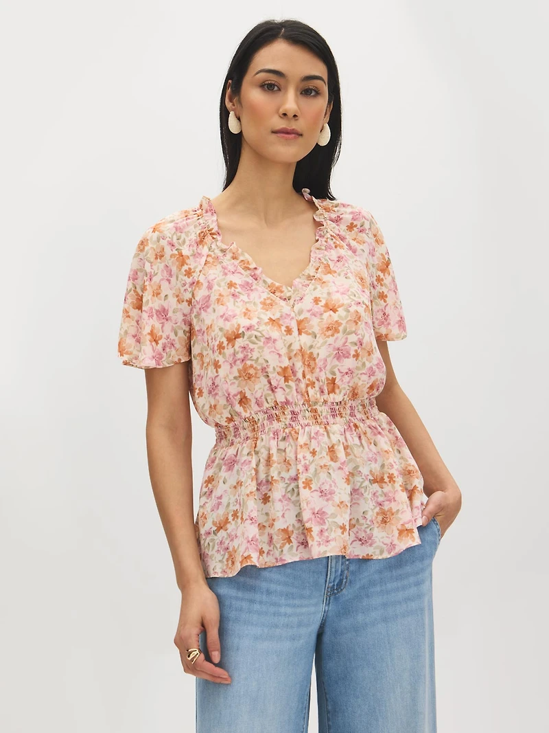 Blouse péplum à motif floral et col en V
