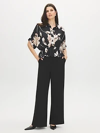 Blouse péplum à motif floral et manches dolman