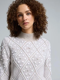 Chandail à col montant avec pompons