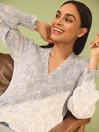 Blouse en mousseline froncée et motif floral