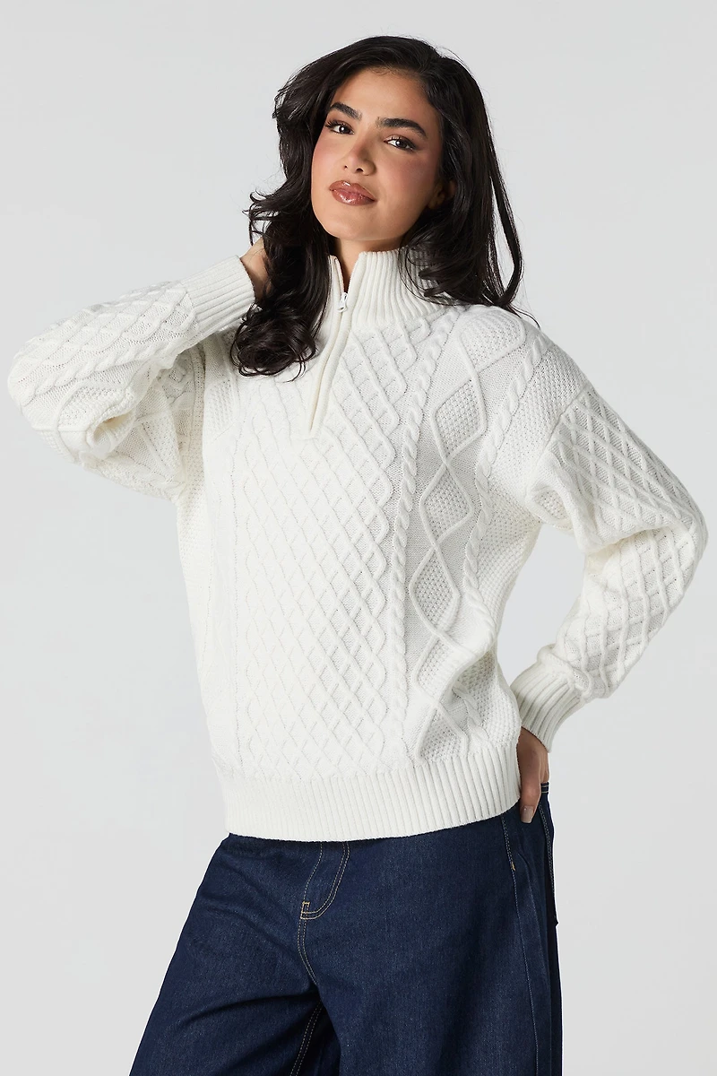 Chandail en tricot mailles torsadées et glissière un quart