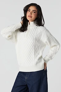 Chandail en tricot mailles torsadées et glissière un quart