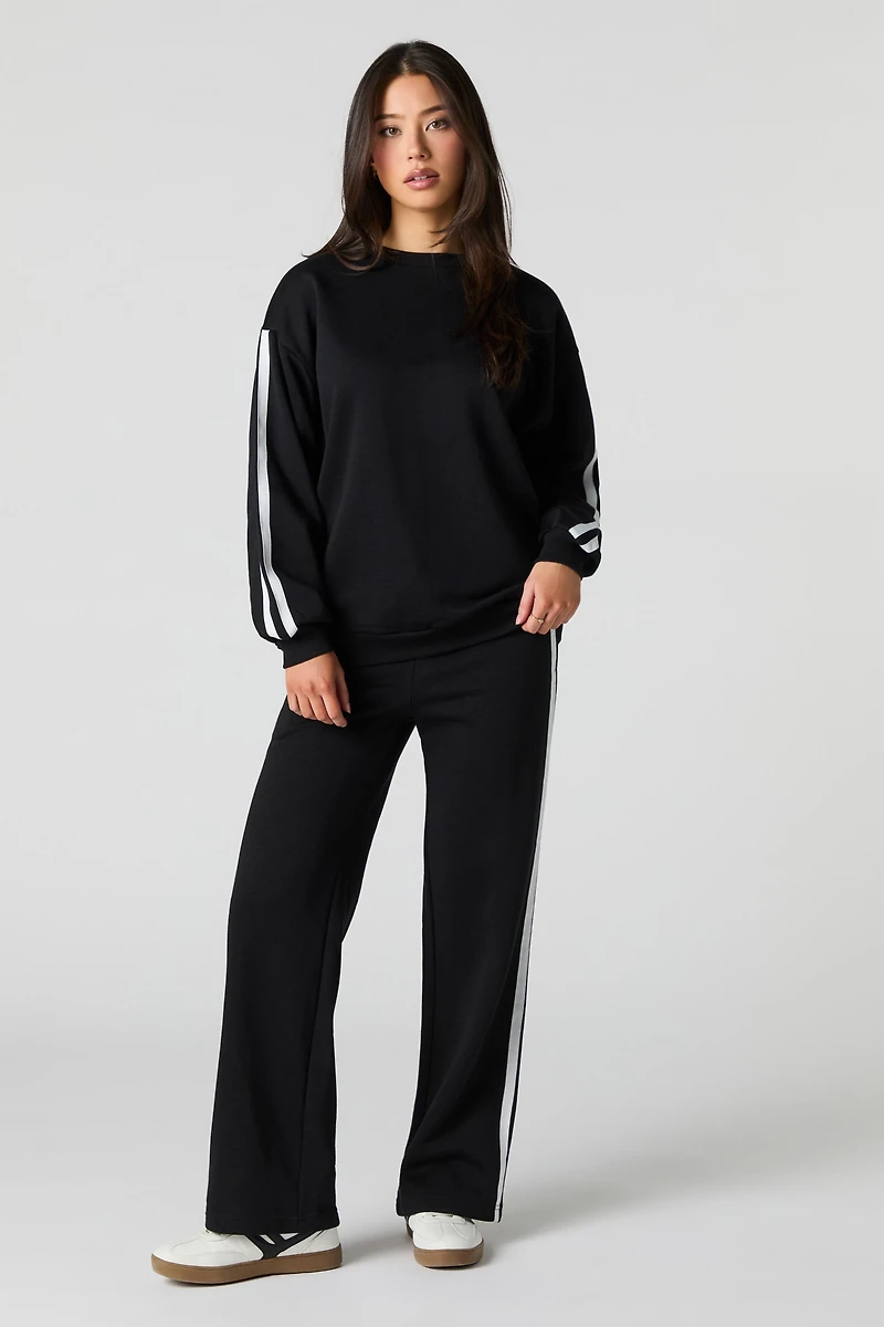 Pantalon d'entraînement en molleton avec rayures latérales