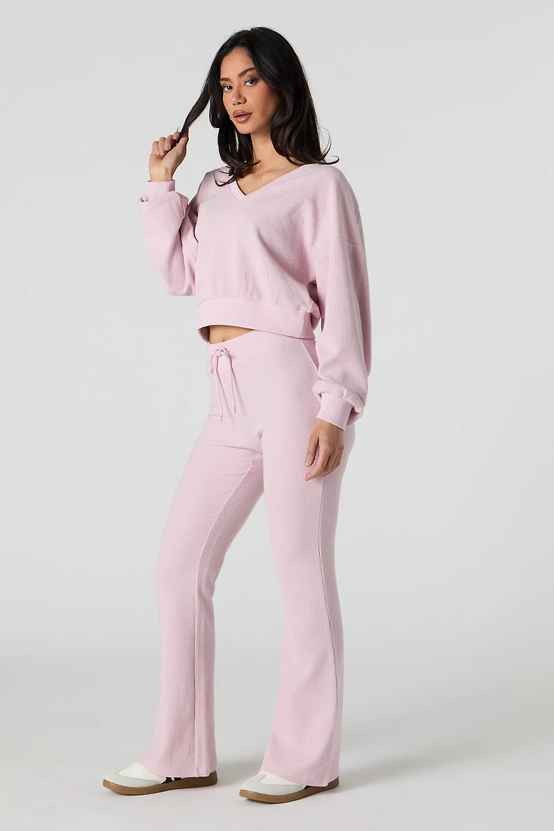 Pantalon en molleton tricot gaufré à jambe évasée