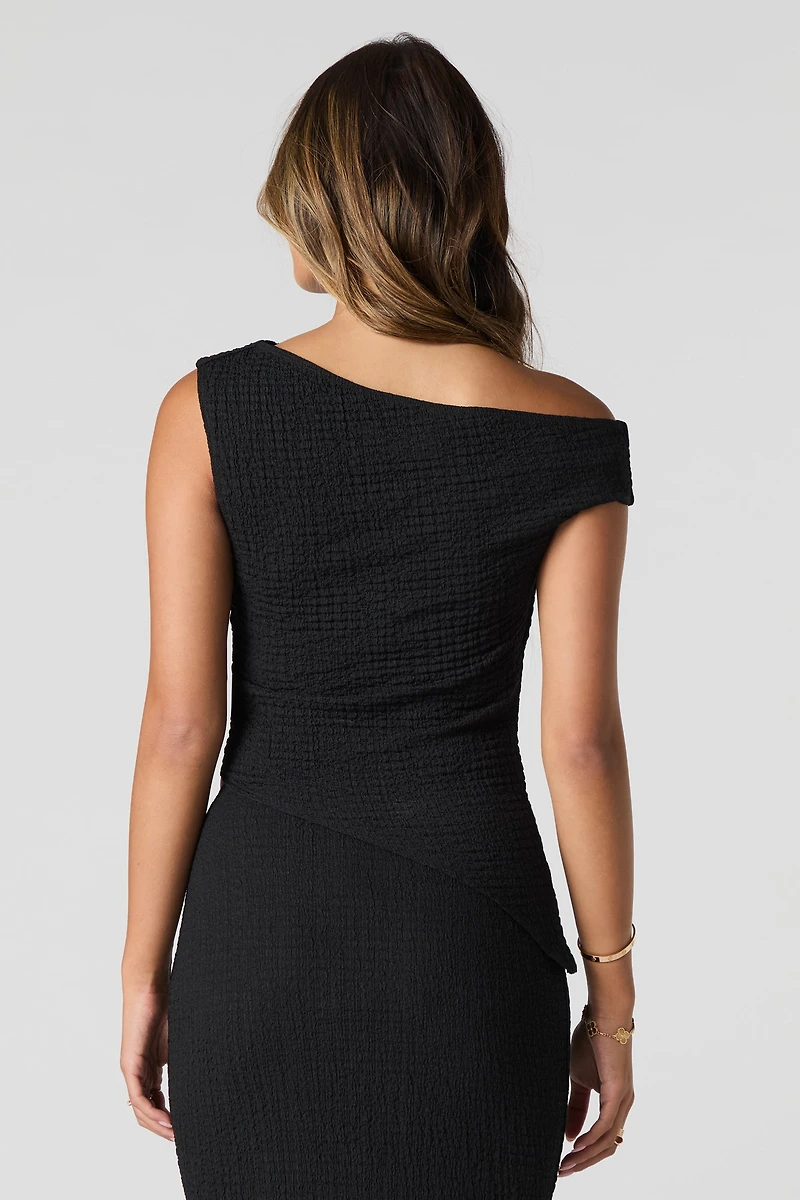 Haut asymétrique texturé à épaule dégagée