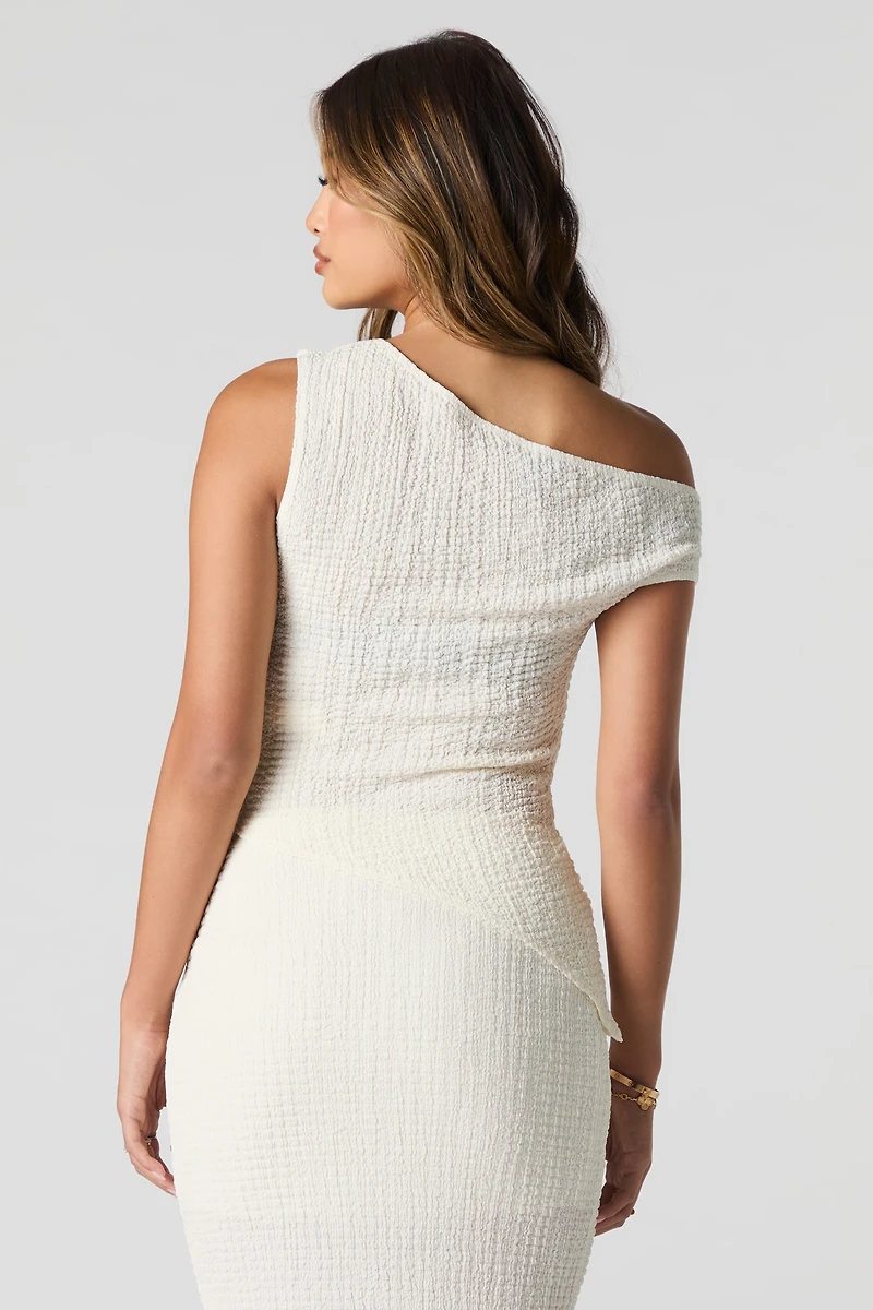 Haut asymétrique texturé à épaule dégagée