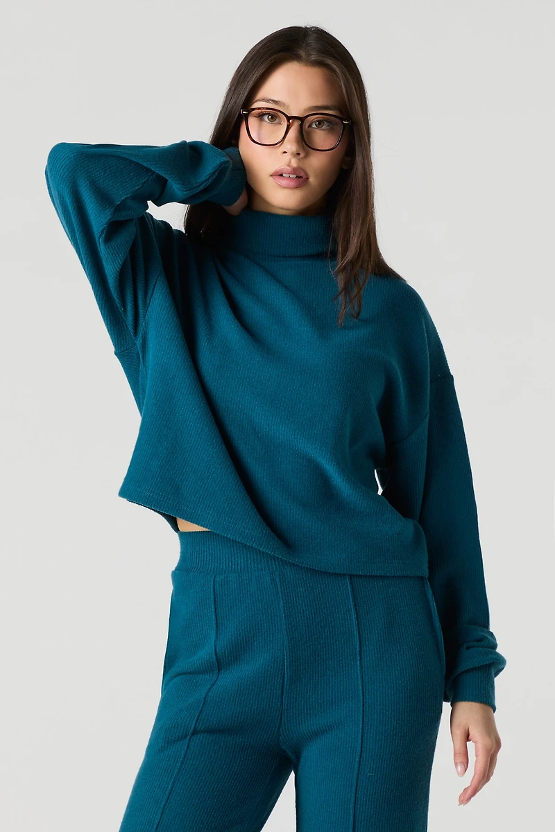Col roulé en tricot côtel