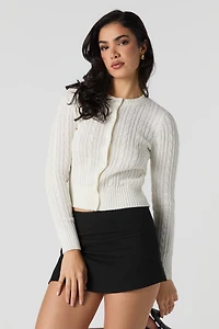 Cardigan en tricot mailles torsadées