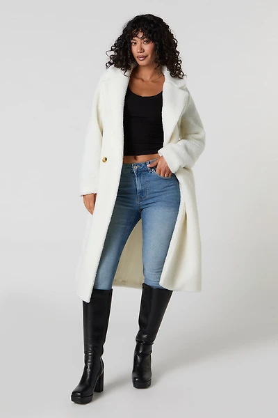 Manteau midi boutonné en Sherpa