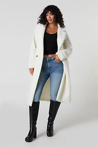 Manteau midi boutonné en Sherpa
