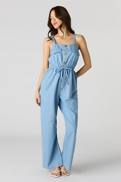 Combinaison en denim boutonnée à l'avant