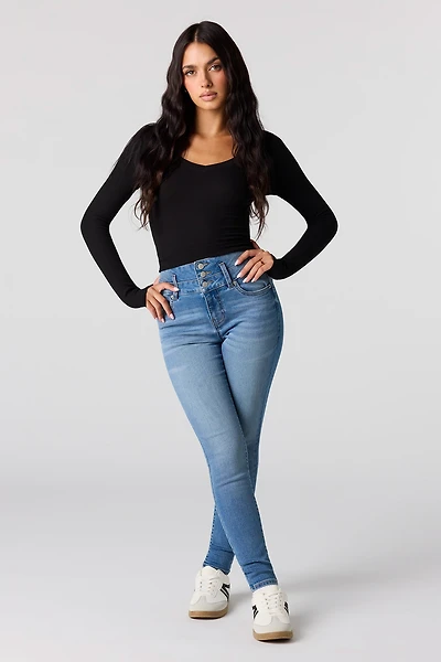 Jean remonte-fesses ajusté délavé moyen à taille haute