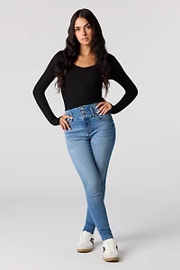 Jean remonte-fesses ajusté délavé moyen à taille haute