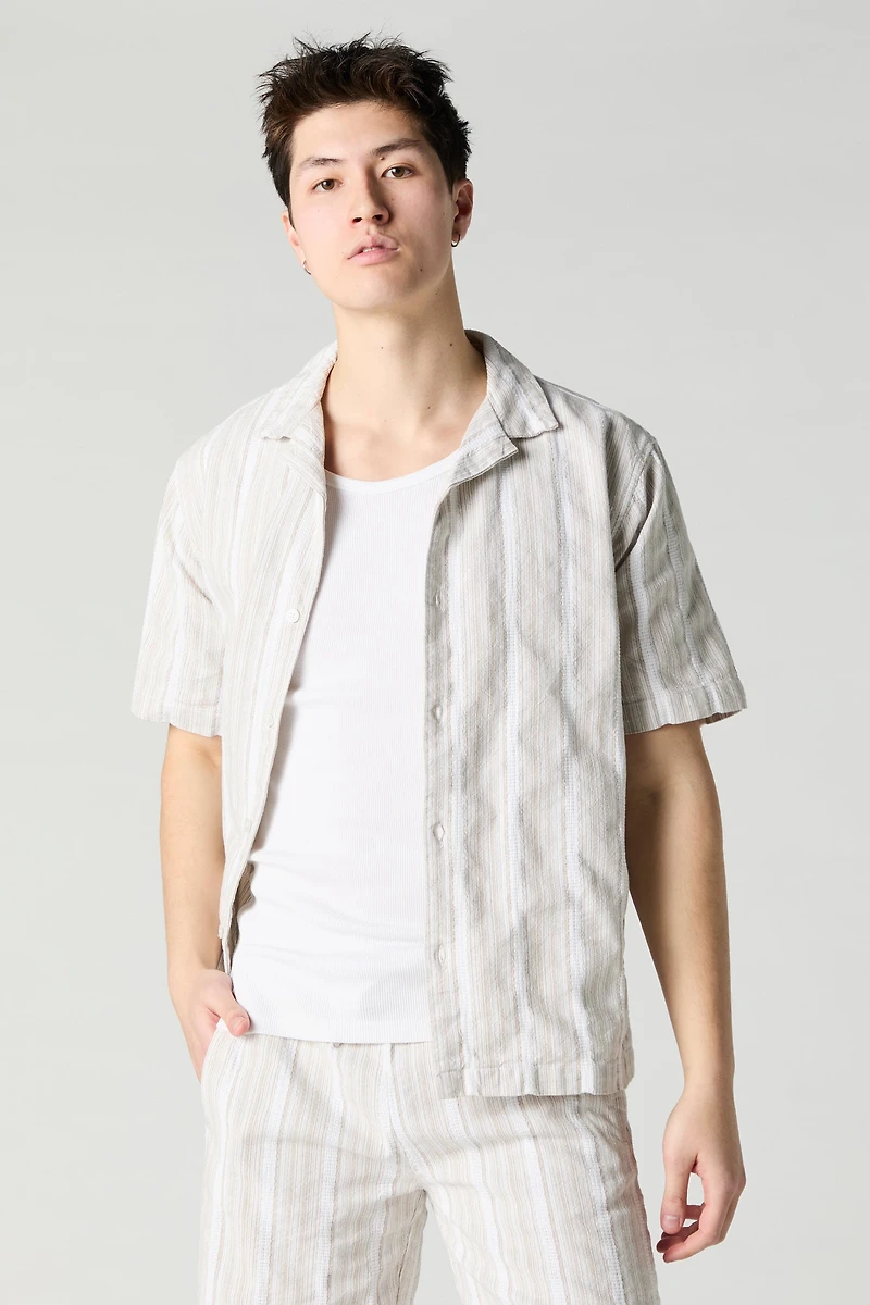 Haut boutonné en tricot rayé