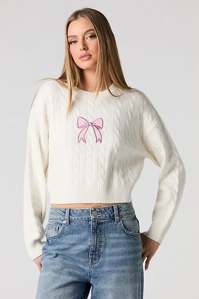 Chandail en tricot torsadé avec motif brodé