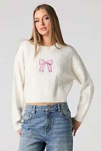 Chandail en tricot torsadé avec motif brodé