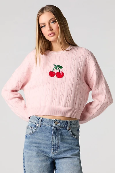 Chandail en tricot torsadé avec motif brodé