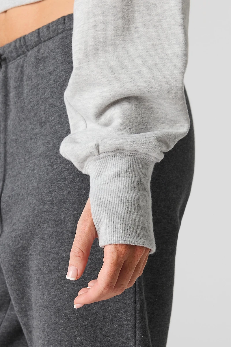 Chandail en tissu bouclé de luxe à épaules dénudées