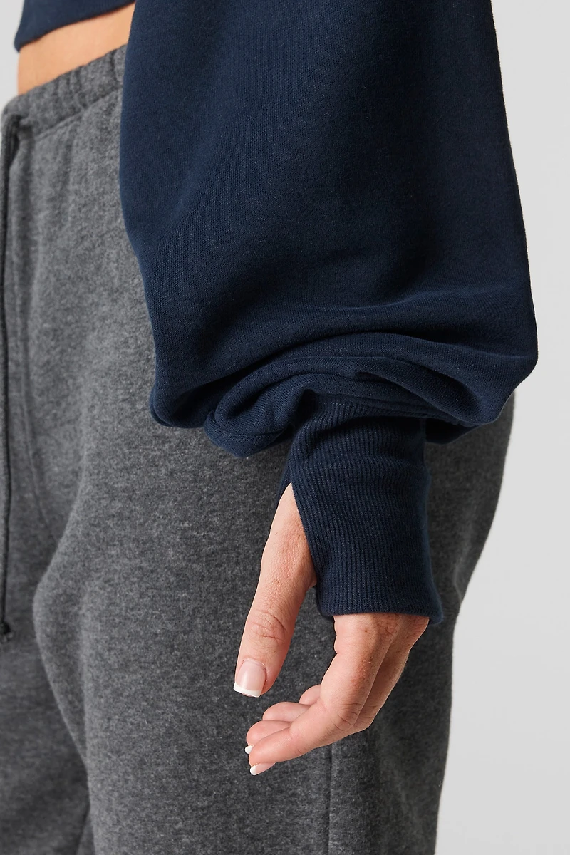 Chandail en tissu bouclé de luxe à épaules dénudées