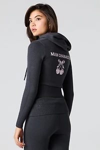 Haut à capuchon en tricot jacquard et glissière