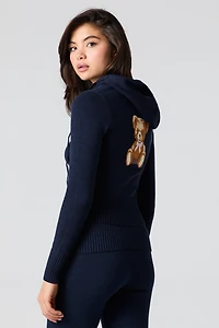 Haut à capuchon en tricot jacquard et glissière
