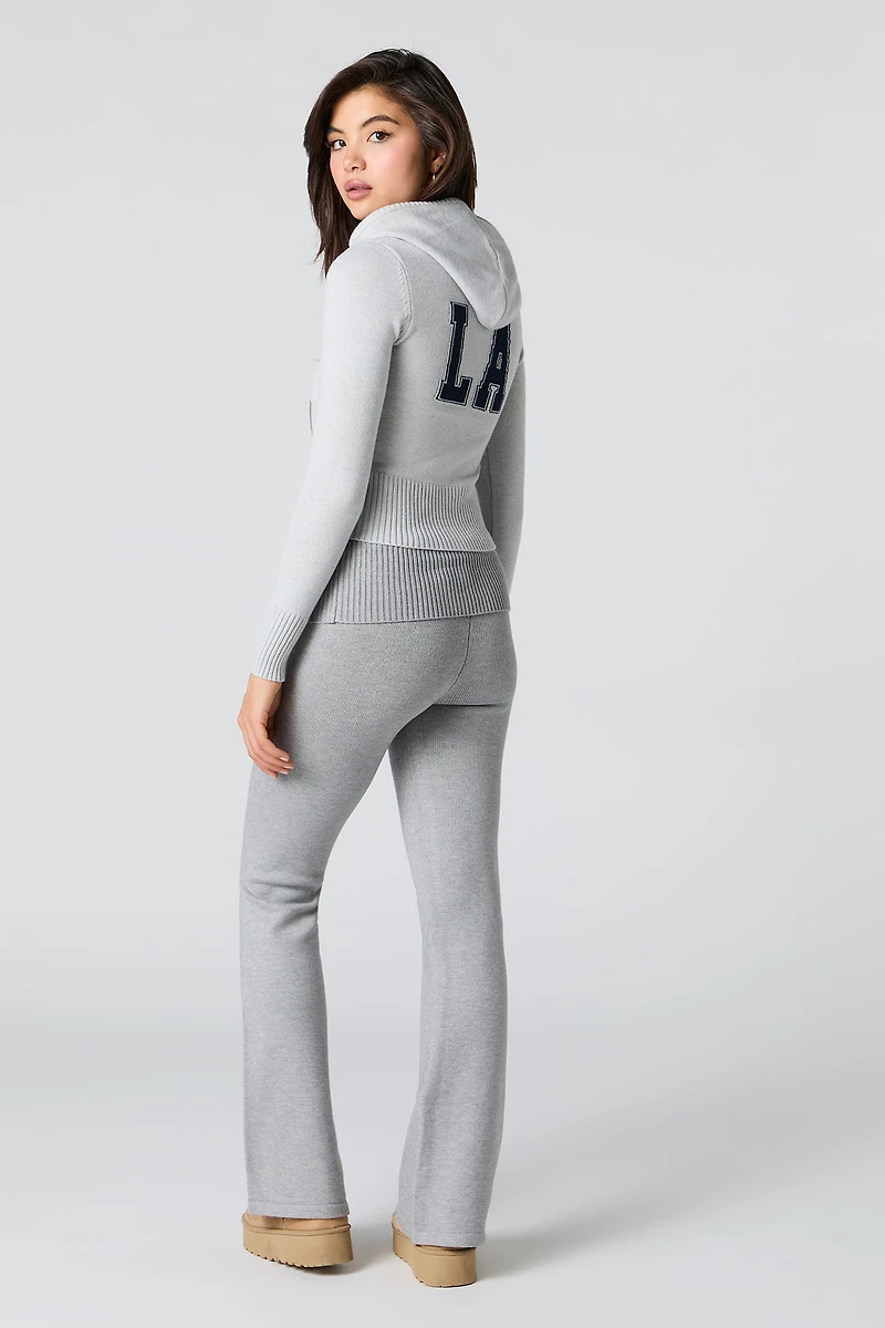 Pantalon en tricot à taille repliée et jambe évasée