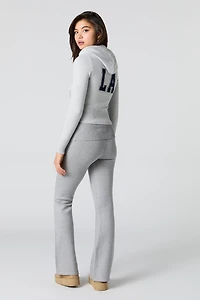 Pantalon en tricot à taille repliée et jambe évasée