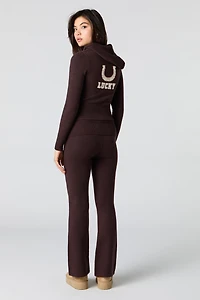 Pantalon en tricot à taille repliée et jambe évasée
