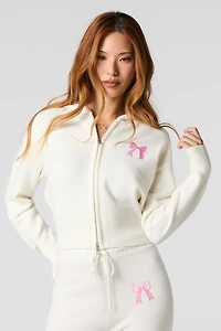 Haut à capuchon avec motif brodé et fermeture glissière