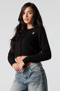 Cardigan écourté en tricot mailles torsadées et broderie
