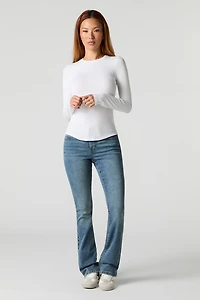 Jean extensible évasé remonte-fesses à taille basse