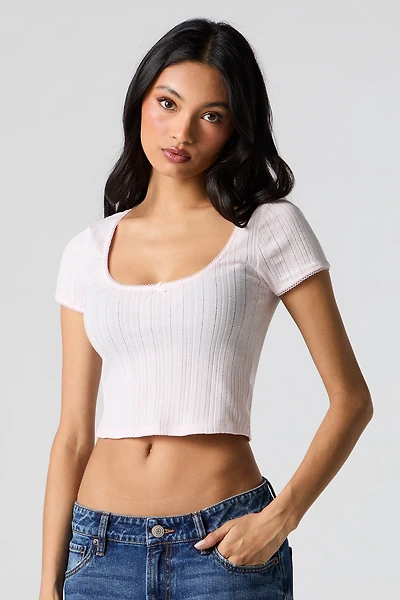 Haut écourté à encolure ronde en tricot pointelle